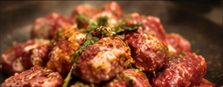 hands seasoning meat for no spatula cooking